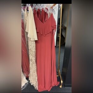 Terracotta/Rust bridesmaids dress. Can be worn with sleeves up or down under arm